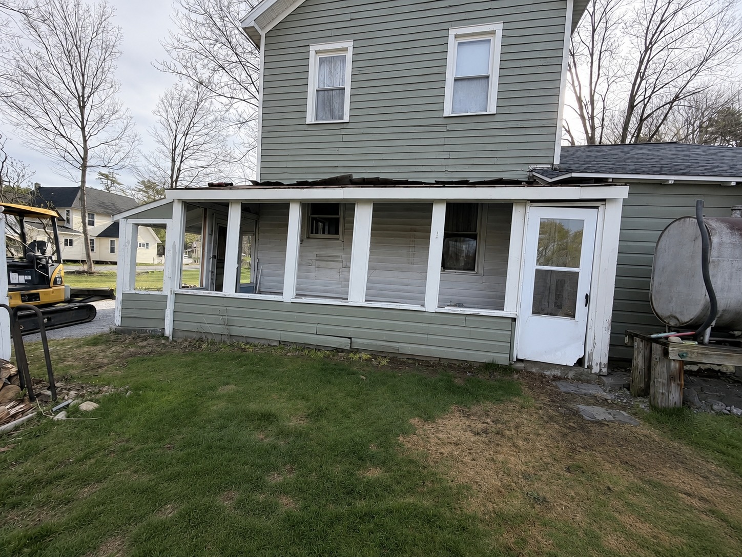 Enclosed porch before demolition
